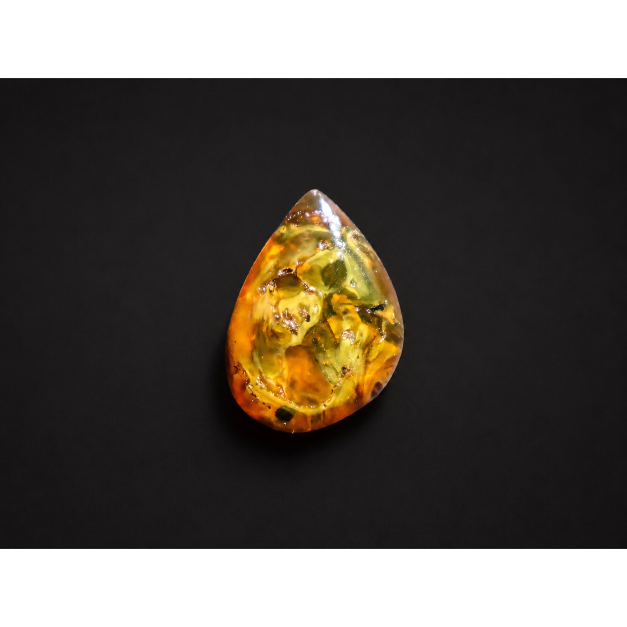 Translucent yellow orange Natural Dominican Amber teardrop Polished Stone 26 mm – photo 3