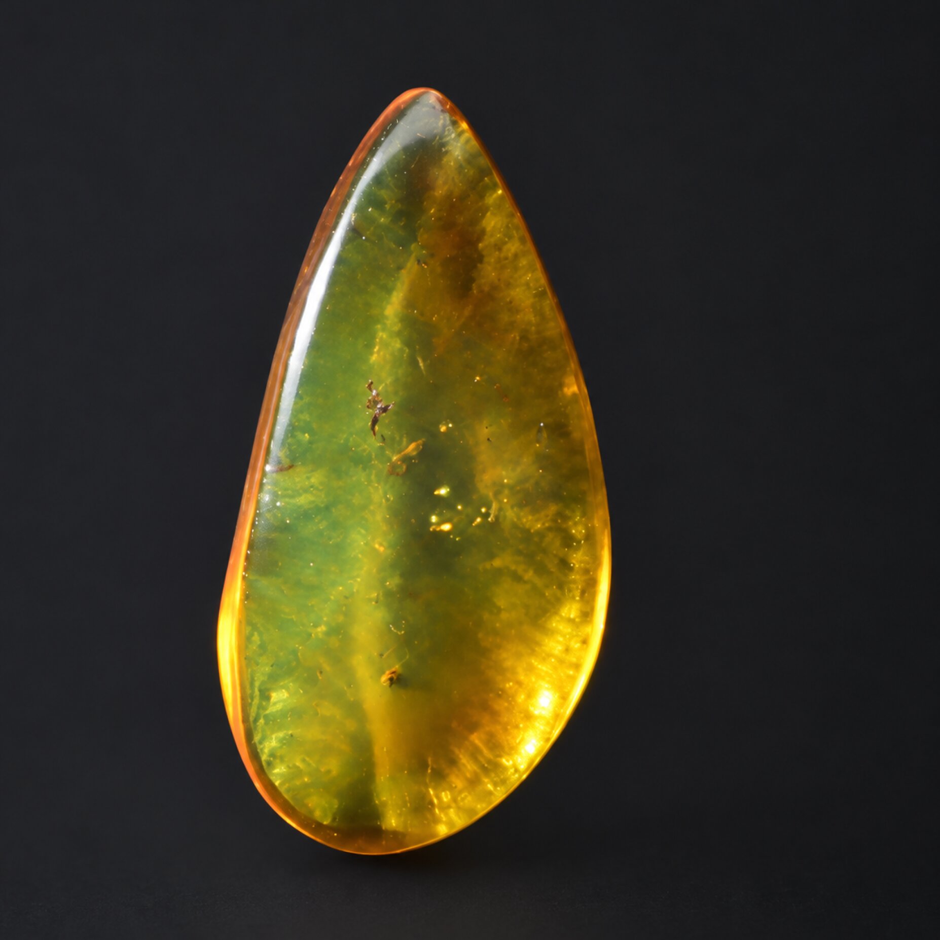 Natural orange green polished Dominican amber